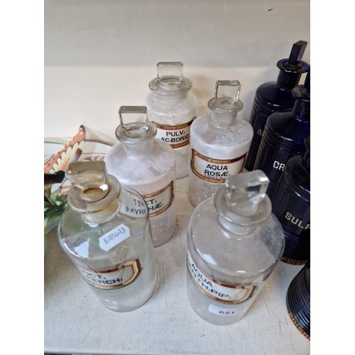 651 - A group of five clear glass apothecary bottles