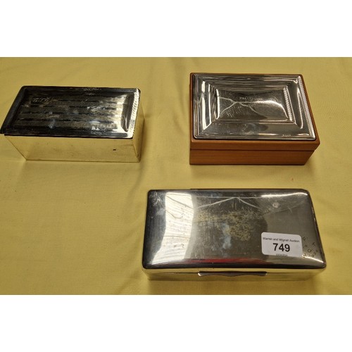 749 - Three silver plated cigarette boxes including shipping line.