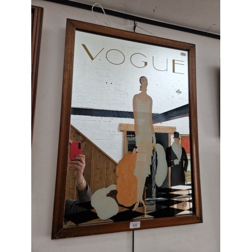 832 - A Vogue advertising mirror, 55.5cm x 76cm.