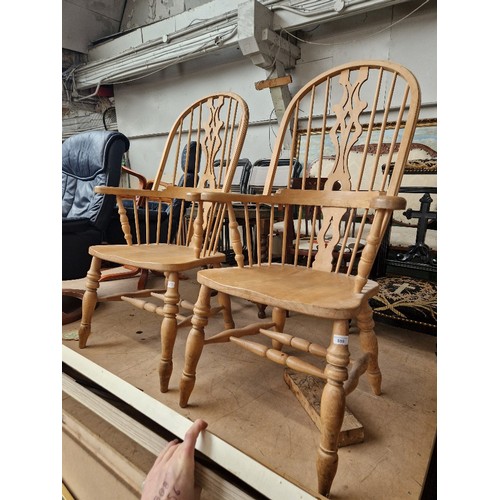 889 - A pair of beech Windsor armchairs.