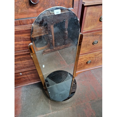 861 - A 1930s Art Deco mirror with peach glass panels and shelf to base.