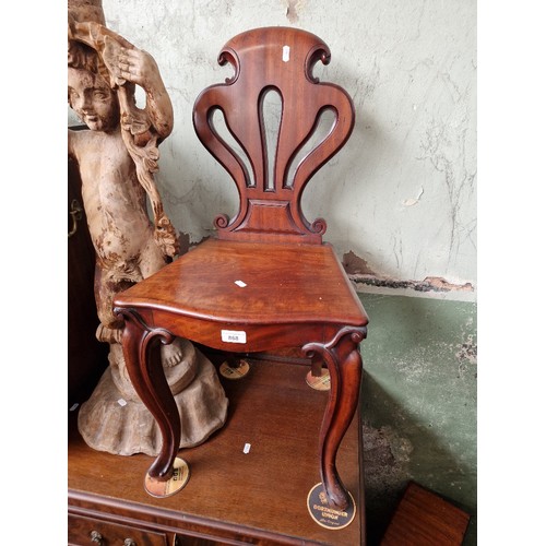 868 - A 19th century mahogany hall chair with cabriole legs & a side table.