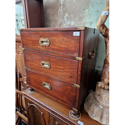 871 - A mahogany campaign style chest of drawers.