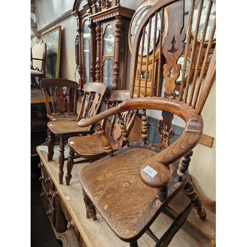 879 - A 19th century beech and elm Windsor chair together with three beech and elm country kitchen/dining ... 