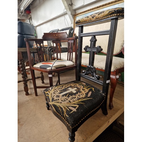 888 - A 19th century ebonised Prie Dieu chair together with an Edwardian inlaid mahogany tub chair.