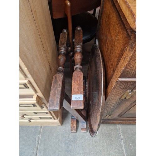 899 - An Arts & Crafts oak and copper top folding table by Hugh Wallis.