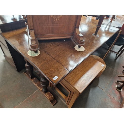 906 - A 1930s oak metamorphic table settee.