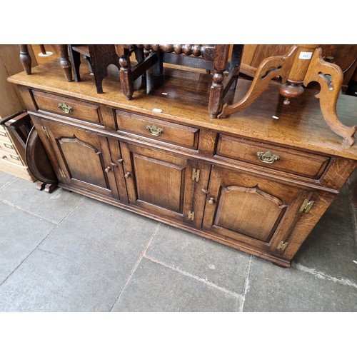 904 - An aged oak sideboard, length 169cm.