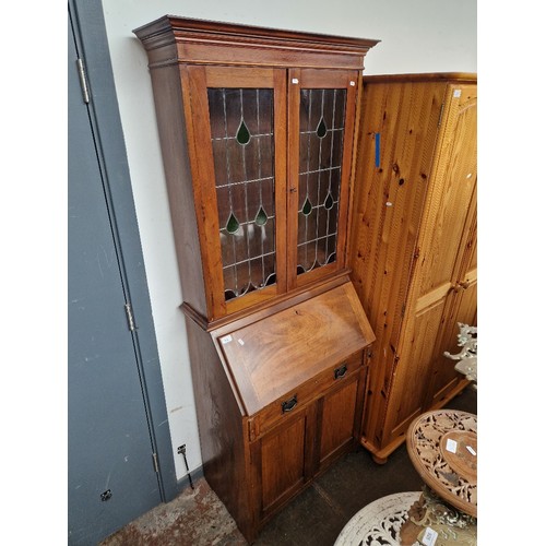 916 - An Edwardian mahogany bureau bookcase with leaded glass to the doors.