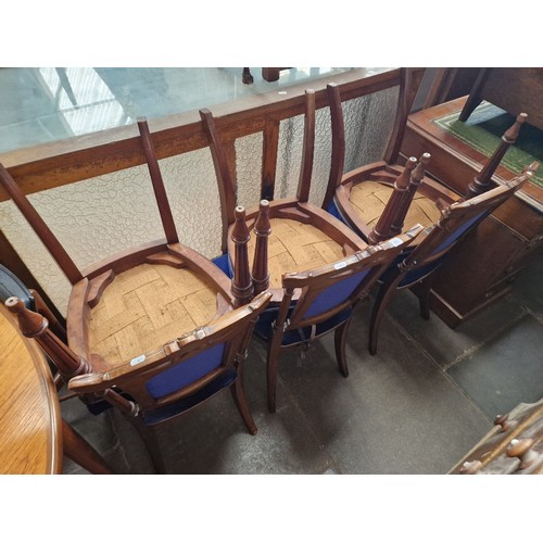 913 - A set of six Victorian walnut dining chairs.