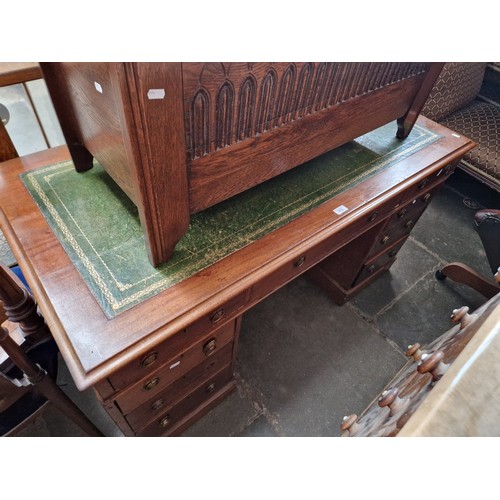 915 - A mahogany twin pedestal desk with tooled leather writing surface, circa 1900.