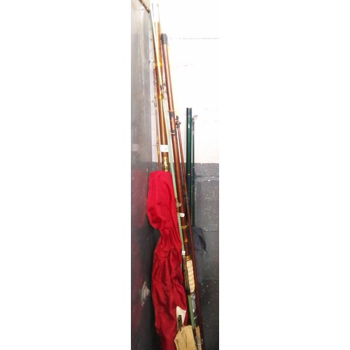 98 - A collection of 5 fishing rods including beech handled 3 piece rod, Shakespeare Patriot beachcaster,... 