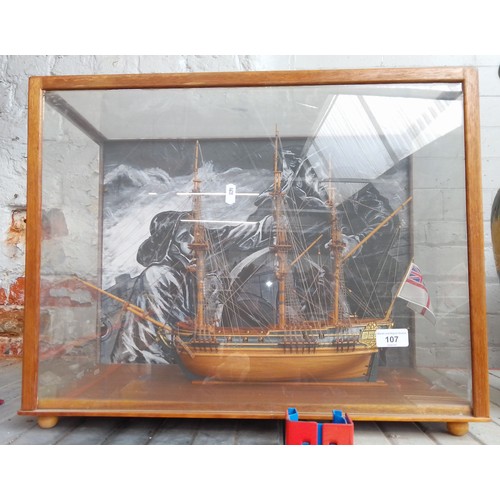 107 - A wooden model of a galleon in a perspex case