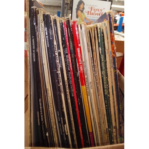 169 - A box of vinyl LP records, rock and pop including Santana, Abba, R Dean Taylor, etc.