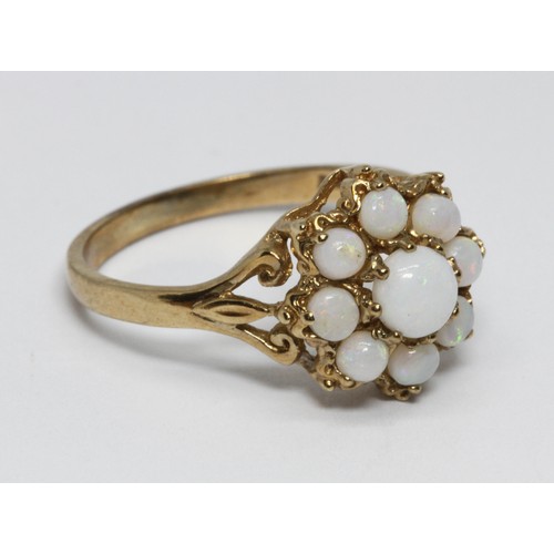 137 - A 9ct gold opal cluster ring, the cluster 11mm in diameter, London 1991, gross weight 2.2g, size O.