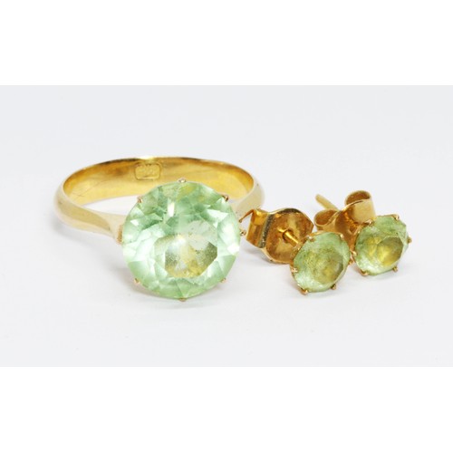 143 - A green paste ring, Chinese characters to inside of band, size P, together with a pair of matching e... 