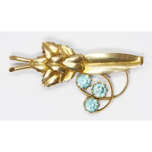 142 - A vintage blue zircon floral brooch, indistinctly marked, length 49mm, gross weight 6g.