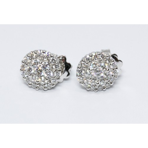 145 - A pair of 18ct white gold diamond cluster earrings, each cluster formed from 21 round brilliant cut ... 