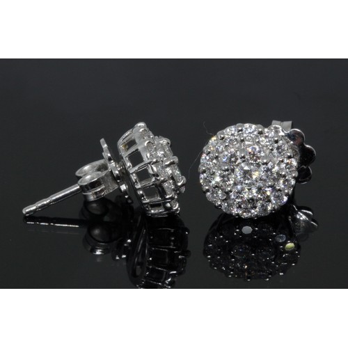 145 - A pair of 18ct white gold diamond cluster earrings, each cluster formed from 21 round brilliant cut ... 