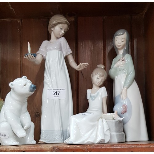 749K - Three Nao figurines and Lladro polar bear figurine.