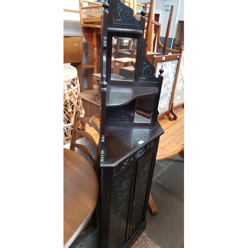 931 - A late Victorian Aesthetic Movement ebonised corner cabinet.