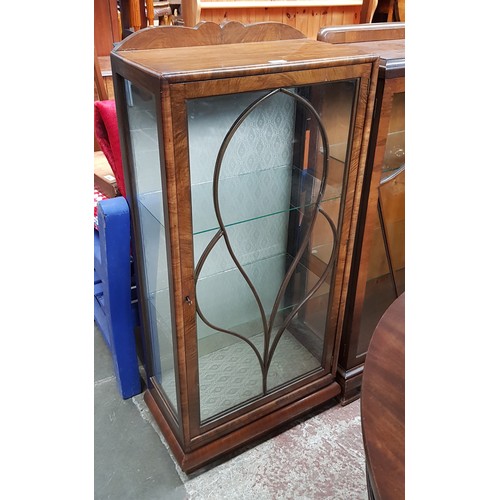 955 - A 1930s Art Deco walnut display cabinet.