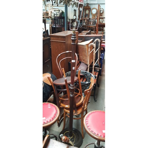 947 - A pair of Fischel chairs and a bentwood chair, together with a beech standard lamp.