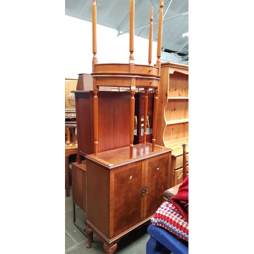 940 - A walnut drinks cabinet together with a pair of demi-lune side tables.