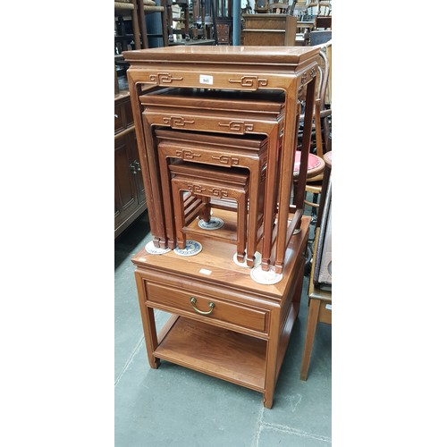 945 - A Chinese hardwood nest of tables and matching side table.