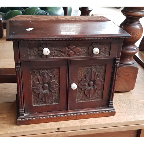 974 - A Victorian carved oak miniature chiffonier/sideboard with ceramic handles.