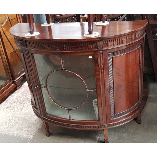 963 - An early 20th century mahogany demi-lune display cabinet.