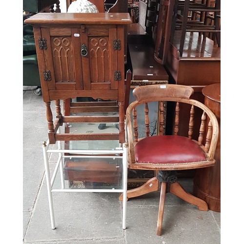 970 - A mixed lot comprising oak side cabinet, glass two tier table and a vintage captain's chair.