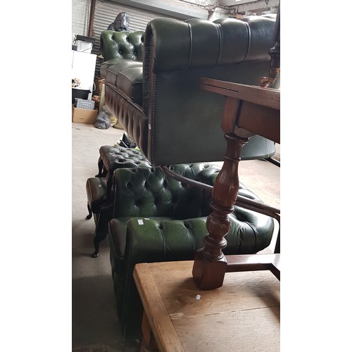 977 - A green leather Chesterfield suite comprising three seater sofa, club chair, wingback armchair and f... 