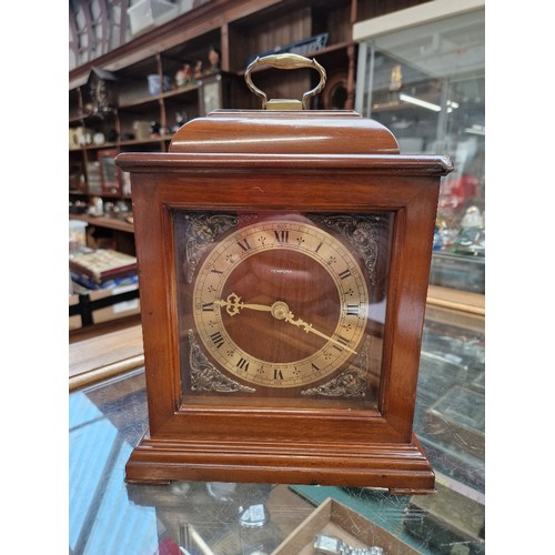 708 - A reproduction mahogany bracket clock