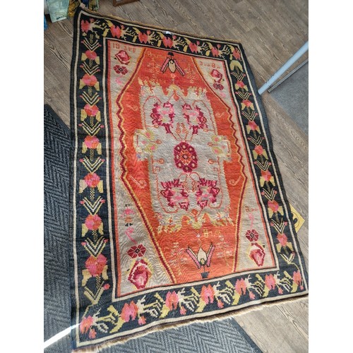 857 - A vintage Turkish Kilim wool carpet dated 1934, geometric design, 203cm x 137cm (approx).