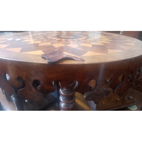 903 - A Victorian oak and walnut parquetry inlaid pedestal table with various specimen woods to the top.