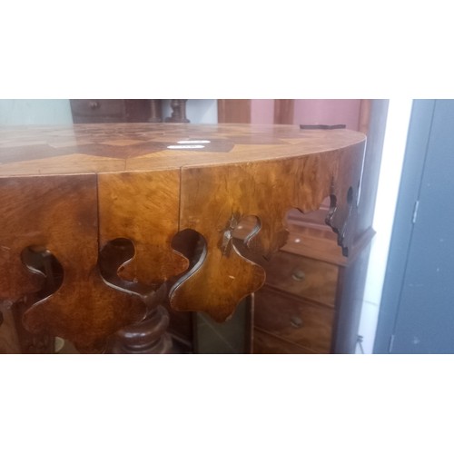 903 - A Victorian oak and walnut parquetry inlaid pedestal table with various specimen woods to the top.