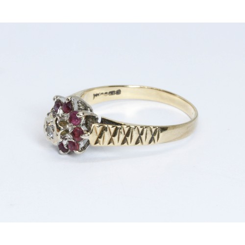 180 - A hallmarked 9ct gold diamond and ruby cluster ring, gross weight 2.6g, size N.