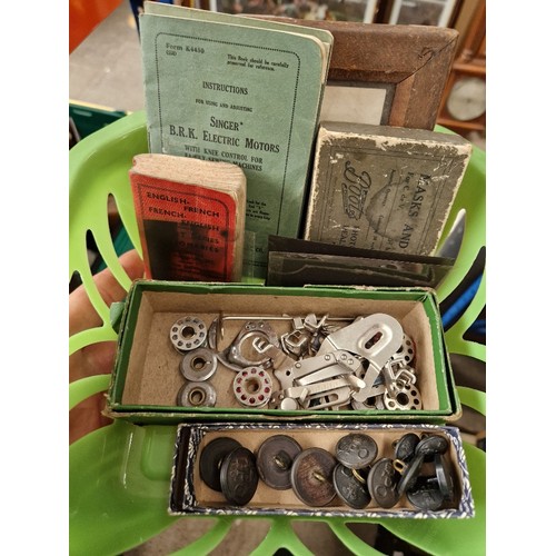 333 - Four boxes of assorted collectables including pens, sewing machine accessories, Geobel glass, milita... 