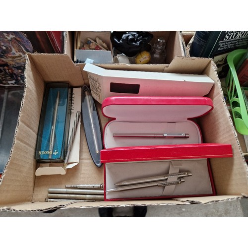 333 - Four boxes of assorted collectables including pens, sewing machine accessories, Geobel glass, milita... 