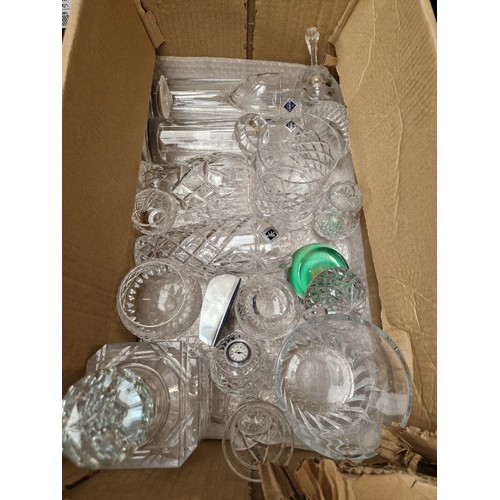 683 - Four boxes of coloured and clear glassware including decanters, glasses, vases etc by Caithness, Wat... 