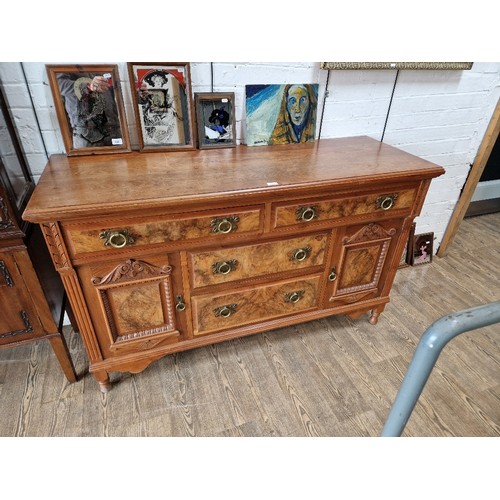 1008 - An Edwardian walnut sideboard with Art Nouveau style brass handles.