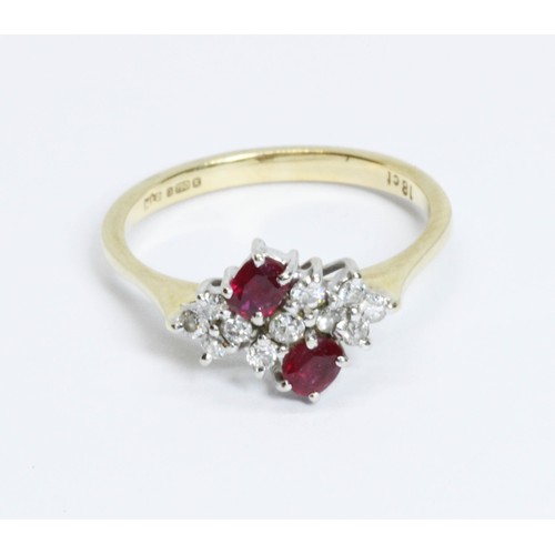 209 - An 18ct gold ruby and diamond cluster ring, the cluster measuring approximately 13mm x 9.70mm, impor... 