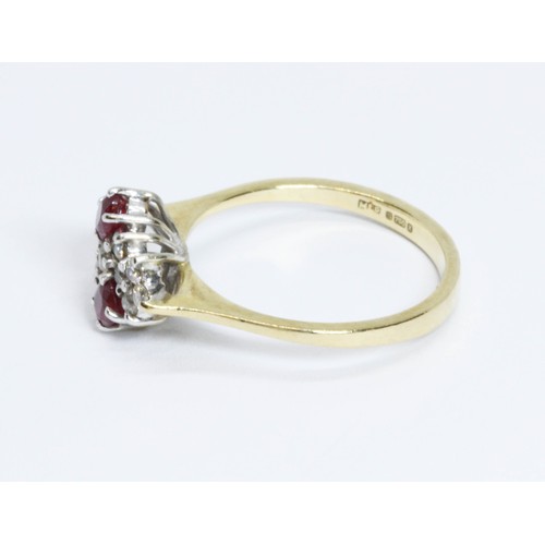 209 - An 18ct gold ruby and diamond cluster ring, the cluster measuring approximately 13mm x 9.70mm, impor... 