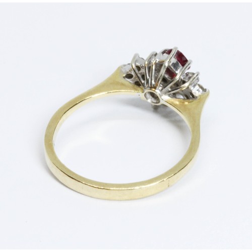 209 - An 18ct gold ruby and diamond cluster ring, the cluster measuring approximately 13mm x 9.70mm, impor... 