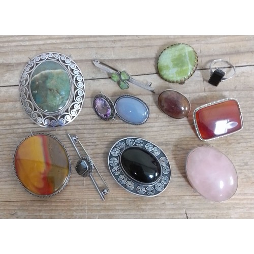 343 - A collection of vintage hardstone cabochon brooches including silver.