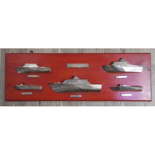 401 - A display of cast silver half hull boats, modelled after boats produced by Anchorage Ltd, Windermere... 