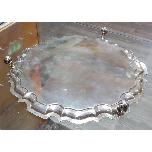 403 - A late Victorian/Edwardian large silver salver, scalloped edge, stood on three scroll feet, Goldsmit... 