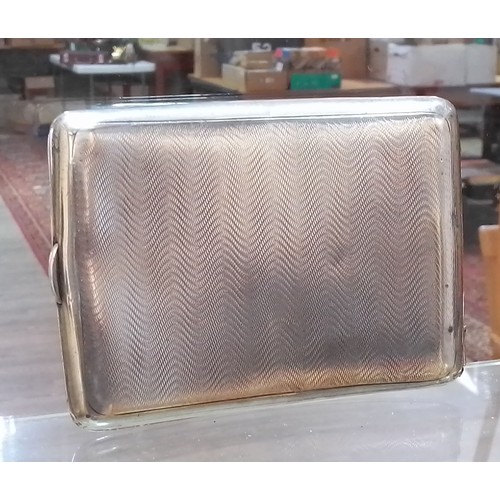 428 - A hallmarked silver cigarette case, 8.5cm x 11.5cm, weight 5.8ozt.