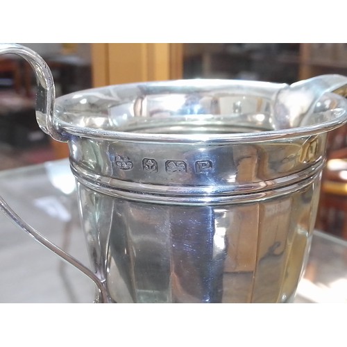 427 - A hallmarked silver cream jug and sugar bowl, weight 3.7ozt.